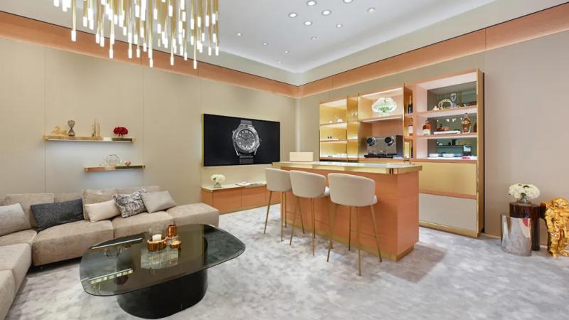 A stylish lounge space offers a bar and a place to relax inside the store.