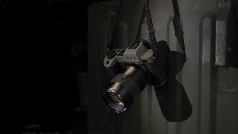 The Leica SL2-S Reporter hanging from a strap