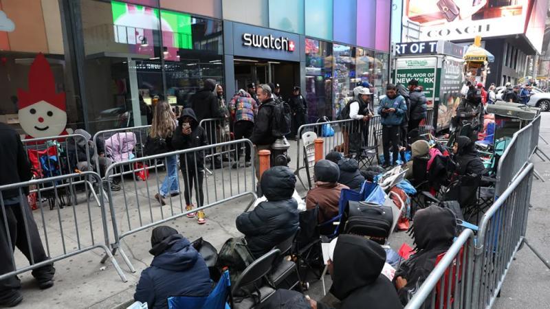 People camping out in line outside of the Swatch store in Times Square in New York, ahead of the May 16