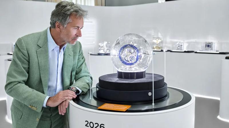 Marc Newson inspects his Atmos Hybris Artistica Tellerium clock design for Jaeger-LeCoultre at Salone in Milan.