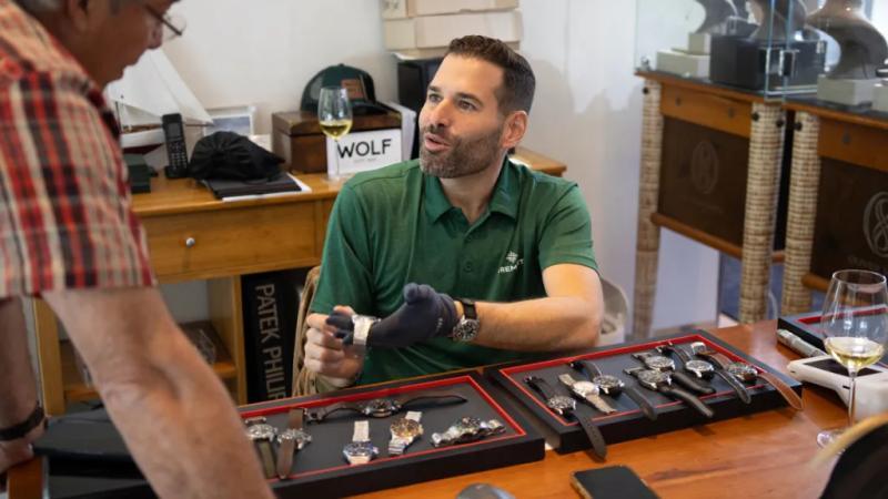 A watch enthusiast chats with Miguel Ortiz, Bremont U.S. brand president at the 2024 Watch Week Aspen