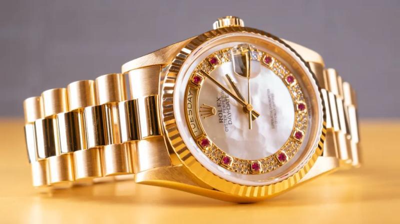 Rolex Day-Date with mother-of-pearl dial and rubies.