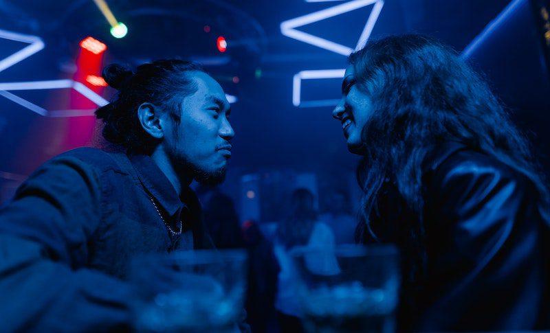 man and woman having drinks- approach a woman