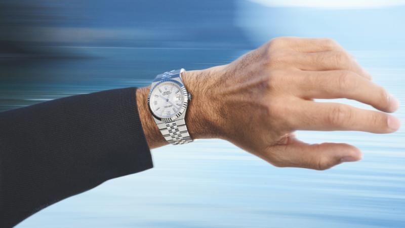 Roger Federer wearing a Rolex Land-Dweller 40 in a white Rolesor