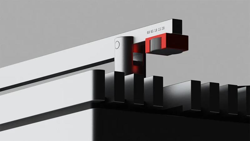 The tonearm's bright red counterweight